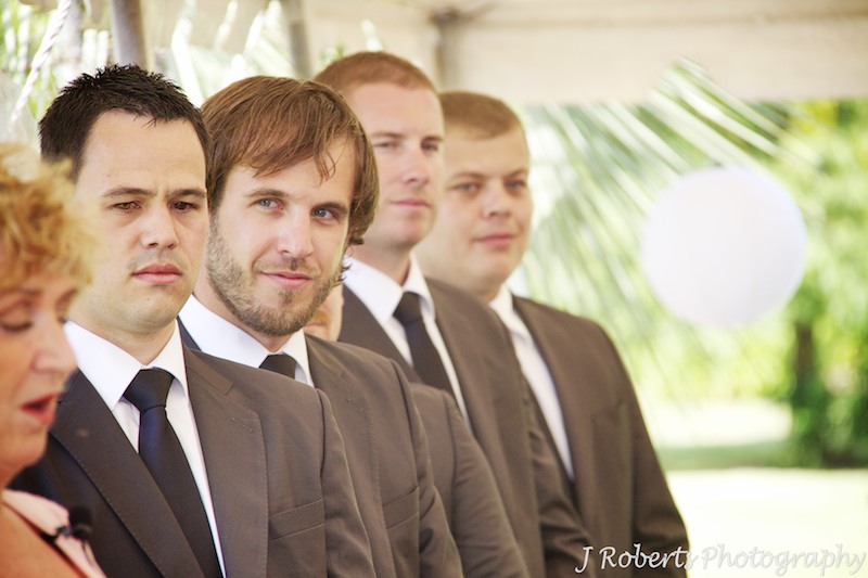 Groomsmen looking on during wedding ceremony - wedding photography sydney